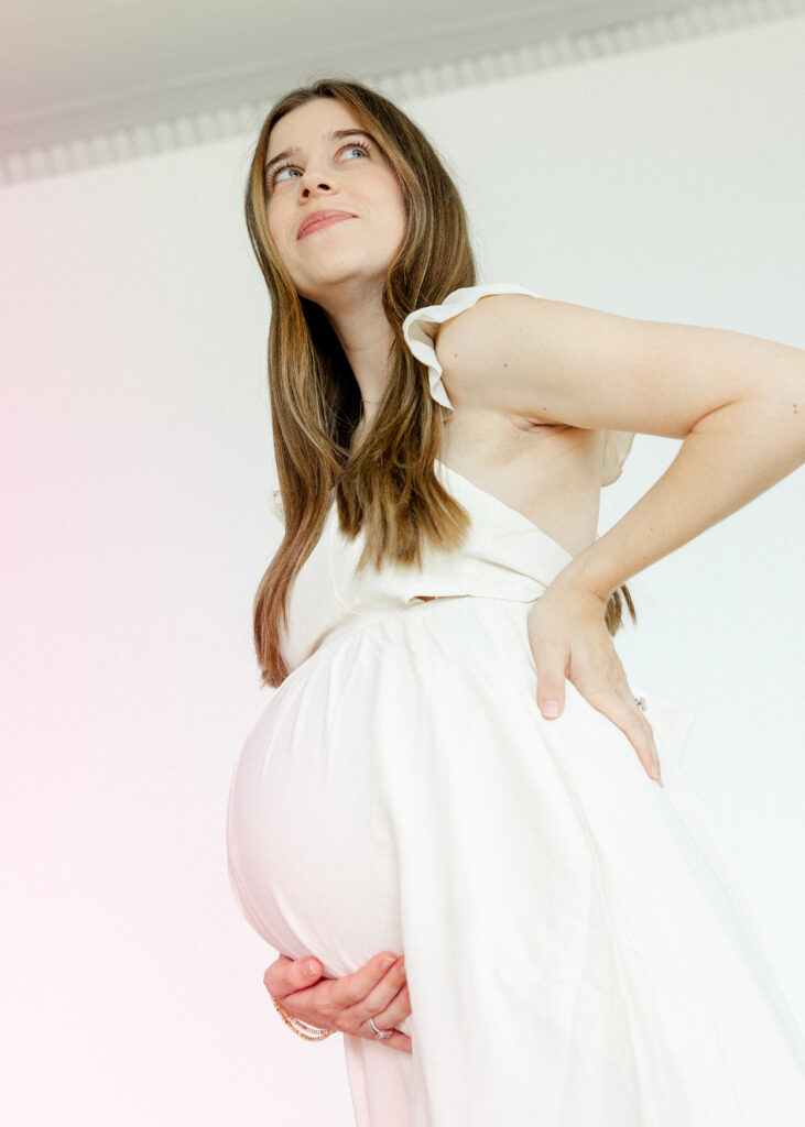 mom holding belly before 2nd daughter's arrival, the lumen room denton texas
